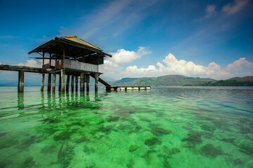 building on a clear sea under a blue sky. Indonesian landscapes tropical beaches.