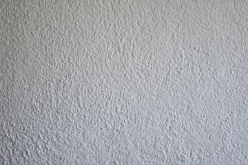 White grainy stucco wall texture, no people