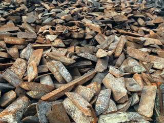 The form of cast iron: ingots, ingots solid condition. Ingots of cast iron stored in the warehouse. Transfer cast iron is cast iron used for further processing into steel. 