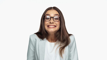 Obraz premium overjoyed businesswoman in grey blazer and eyeglasses smiling isolated on white.