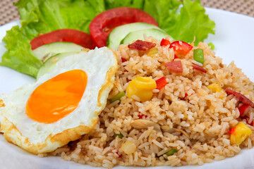 Egg fried rice mixed with fresh vegetables