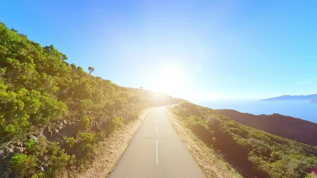 sunset aerial HYPER-LAPSE aerial view of the road D824 route of the Piana Badlands. Les Calanques of Piana, a natural park of Corsica on the Mediterranean sea by the Porto Ota town. 360 view