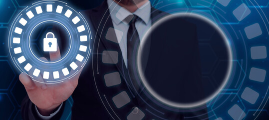 Businessman Pointing A Finger On A Digital Lock In A Futuristic Round Design. Standing Man In A Suit Showing Encrypted Messages And Data In A Secured Connection.