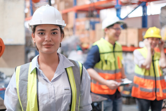 women Engineer check and control welding robotics automatic arms machine on modern virtual interface in intelligent factory automotive industrial with monitoring system software. Digital manufacturing