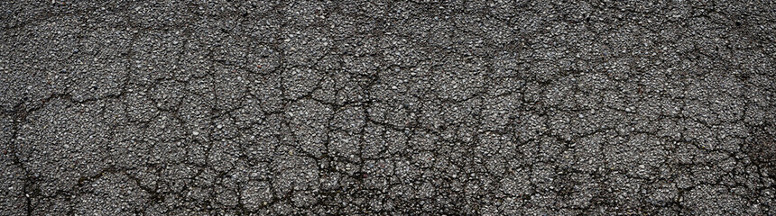 Abstract panoramic background. Monochrome texture of cracked asphalt - obrazy, fototapety, plakaty