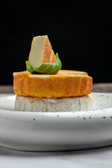 Set of Camembert, Brie, Gorgonzola blue cream cheese with basil leaves and cherry tomatoes on a light background. vertical image. top view. place for text