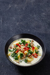 Zuppa Toscana,Tuscan Soup in black bowl, top view