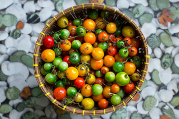colorful tomatoes in a bamboo basket