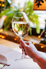 woman with glass of white wine