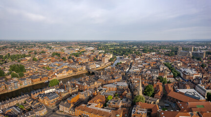 The drone aerial view of York, England. York is a cathedral city with Roman origins, sited at the confluence of the rivers Ouse and Foss in North Yorkshire, England.