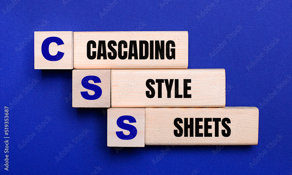 Poster on a bright blue background, light wooden blocks and cubes with the text css cascading style sheets