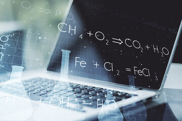 Creative chemistry concept on modern laptop background. Multiexposure