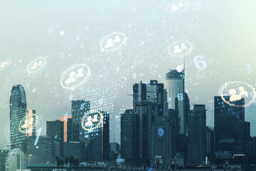 Double exposure of social network icons hologram and world map on Los Angeles city skyscrapers background. Marketing and promotion concept