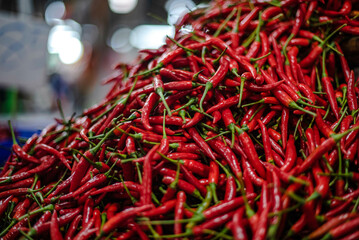 Red chilli is not cool, piled up for sale in Amorn Nakhon Naklua Fresh Food Market, Thailand.