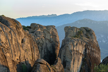 Fototapeta na wymiar conglomerate formation of Meteora during sunset, beside the Pindos Mountains. Central Greece