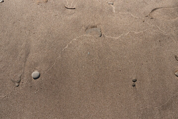 Fototapeta na wymiar Picture of brown sand at a beach. Breakwater Beach, Geneva, Ohio. 