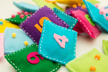 Homemade Game: Find the right pair. A felt square of various colors with numbers and corresponding domino style dots. Early education, learning numbers. Math for Preschooler.
