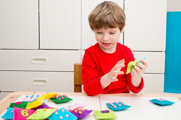 Homemade Game: Find the right pair. A felt square of various colors with numbers and corresponding domino style dots. Early education, learning numbers. Math for Preschooler.