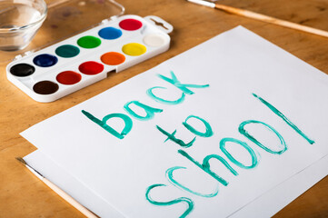 Back to school. School desk with paints. School concept.