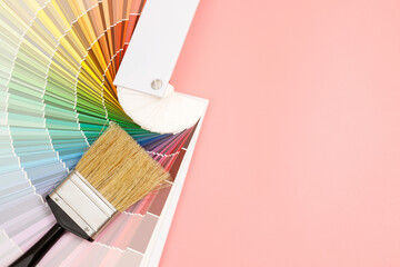 Paint brush on pink background, how to choose the perfect home paint color and good for health