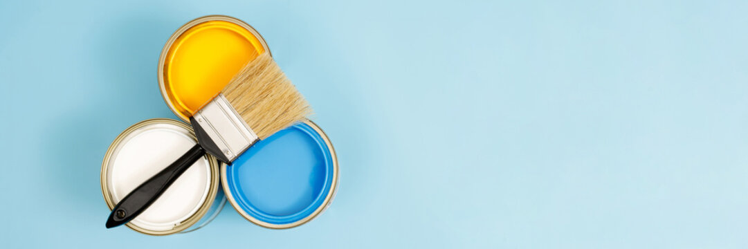 Paint cans and paint brushes and how to choose the perfect interior paint color and good for health