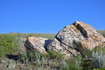  large split sandstone rock on prairie landscape