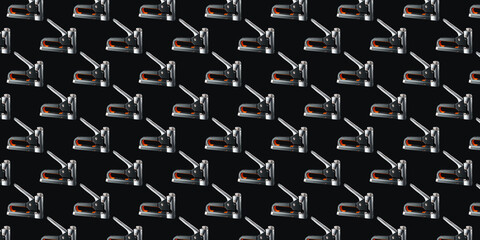 Seamless pattern of construction staplers on a black background. Background for the design. - obrazy, fototapety, plakaty