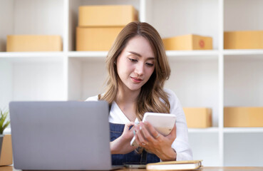 Starting small businesses SME owners female entrepreneurs Write the address on receipt box and check online orders to prepare to pack the boxes, sell to customers, sme business ideas online.