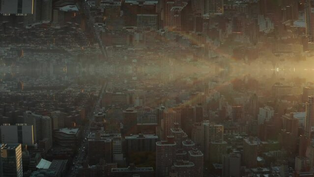 Morning mist above urban development in city at dawn. Abstract computer effect digital composed footage.