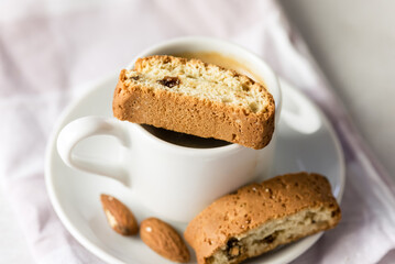 White Cup of Strong Coffee Served with Italian Almond Cookies Cantucci Gray Background Above
