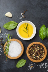 Food background from vegetable, spices, herb on black table.