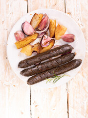 Grilled, roasted vegan sausages. Rustic composition with buckwheat blood sausages on wooden...