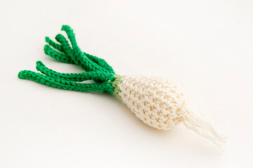 Knitted vegetables: onion. Concept. Styling. Handicrafts. Ecological toys for children to develop fine motor skills. Handmade toys. Montessori education.
