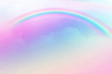 Colorful sky with soft white clouds and the crossing of rainbows. pastel colored magical fantasy background. Sweet Dreams concept for Wallpaper, Backdrops and Design.