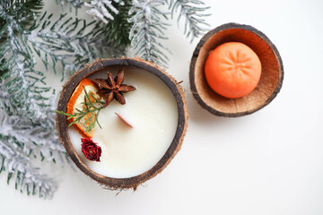 christmas greeting card layout. original candle in coconut made from natural soy wax, spruce...