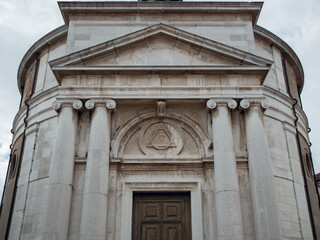Venetian cathedral with columns and large wooden doors
