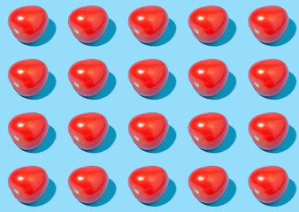 Red ripe tomatoes on a blue background