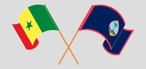 Crossed and waving flags of Senegal and Guam