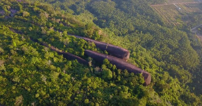 4K-Aerial video from flying drone over landscape with the Mountain in the morning sky at Three Whale Rocks the stone shaped like  whale,famous tourist attraction of Bueng Kan province amazing Thailand