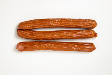 Hunting sausages on a white background. Delicious traditional food