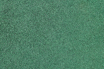 Sports covering from a rubber crumb of green color. View from above.