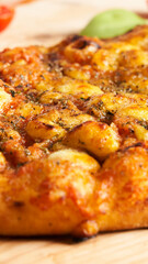 Close-up Traditional Italian pizza. Traditional food from Palermo, Sicily, Italy. Ingredients Tomato sauce, anchovy, onion, cheese, oregano, oil.
