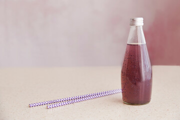 Non-alcoholic vegan healthy organic bottle of drink with blueberries and chia seeds. Soft natural...