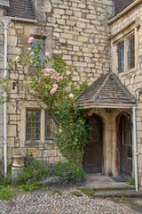 Fototapeta na wymiar Courtyard Garden outside a traditional stone house in the Cotswolds