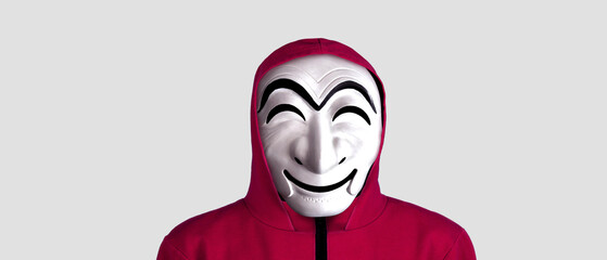 White mask of a robber in a red suit from the series on a white background.