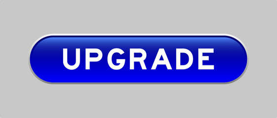 Blue color capsule shape button with word upgrade on gray background