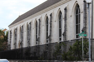 church windows and wrought iron fence
