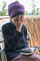 Young religious jewish woman with a headscarf on her head prays with a religious prayer book (52)