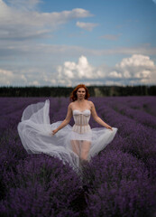 Girl in a white dress in a lavender field summer 2022
