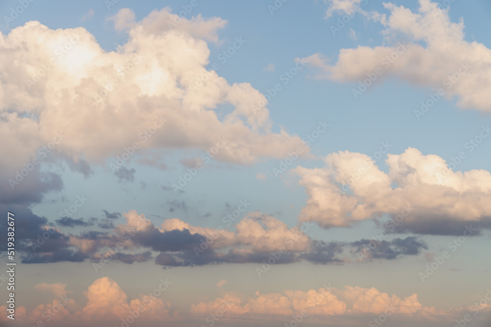 Wall mural beautiful well balanced sky replacement sunset background with layers of fluffy white cumulus clouds